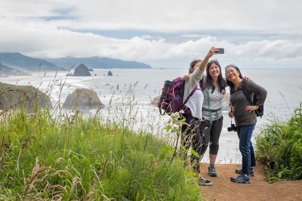 Mother and two daughters hiking in Cannon Beach, Oregon