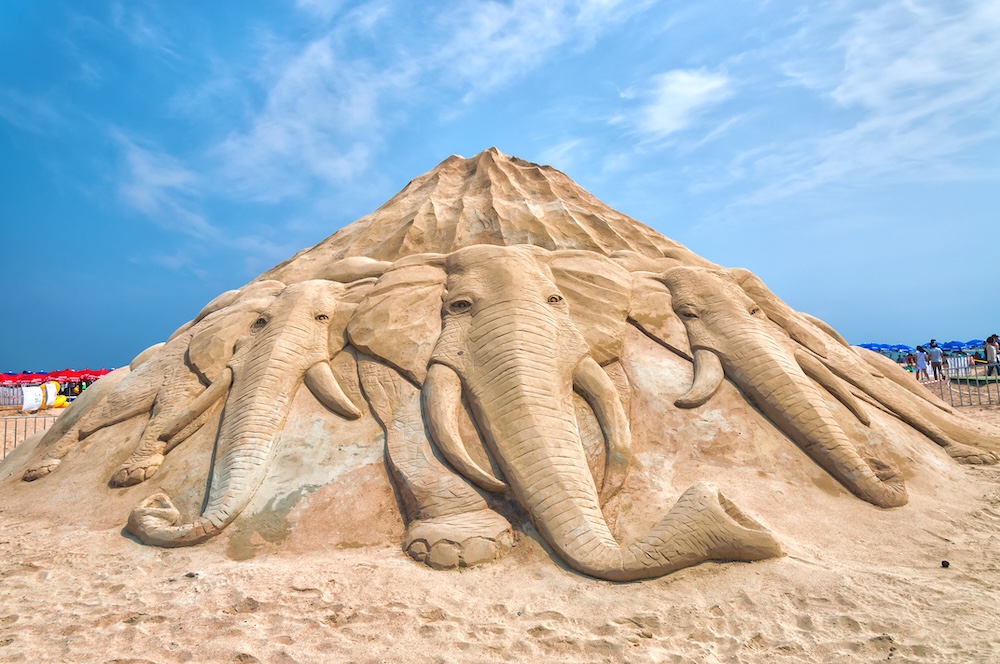 sand sculpture of elephants